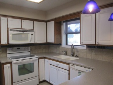Upon entering this well maintained home you are immediately on Holiday Island Golf Course in Arkansas - for sale on GolfHomes.com, golf home, golf lot