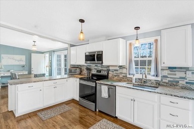 Effortless lakefront living meets income potential--welcome to on Tanglewood Shores Golf Club in Virginia - for sale on GolfHomes.com, golf home, golf lot