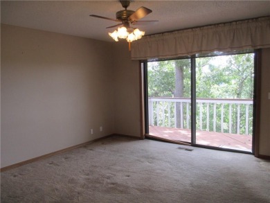 Upon entering this well maintained home you are immediately on Holiday Island Golf Course in Arkansas - for sale on GolfHomes.com, golf home, golf lot