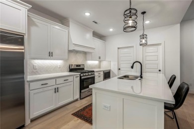 Built in 2024, this home sits on .29 acre lot minutes from I49 on Bella Vista Country Club - Highlands in Arkansas - for sale on GolfHomes.com, golf home, golf lot