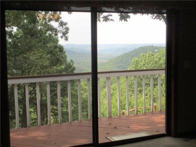 Upon entering this well maintained home you are immediately on Holiday Island Golf Course in Arkansas - for sale on GolfHomes.com, golf home, golf lot