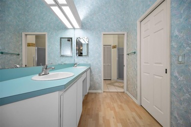 IN TIMBER GREENS A 55+ GATED GOLF COMMUNITY... This 2-bedroom 2 on Timber Greens Country Club in Florida - for sale on GolfHomes.com, golf home, golf lot