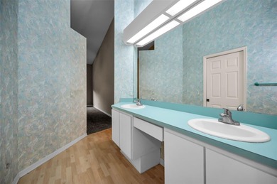 IN TIMBER GREENS A 55+ GATED GOLF COMMUNITY... This 2-bedroom 2 on Timber Greens Country Club in Florida - for sale on GolfHomes.com, golf home, golf lot