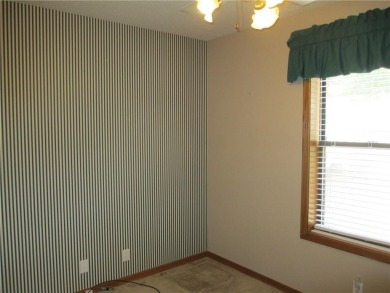 Upon entering this well maintained home you are immediately on Holiday Island Golf Course in Arkansas - for sale on GolfHomes.com, golf home, golf lot
