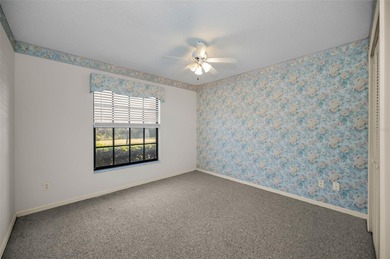 IN TIMBER GREENS A 55+ GATED GOLF COMMUNITY... This 2-bedroom 2 on Timber Greens Country Club in Florida - for sale on GolfHomes.com, golf home, golf lot