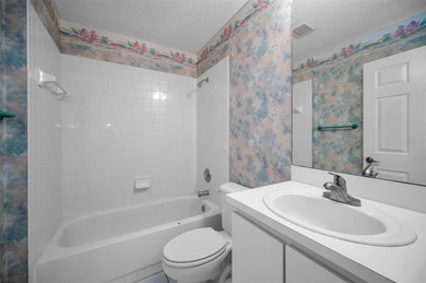 IN TIMBER GREENS A 55+ GATED GOLF COMMUNITY... This 2-bedroom 2 on Timber Greens Country Club in Florida - for sale on GolfHomes.com, golf home, golf lot