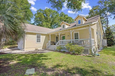 Nestled on a quiet cul-de-sac in The Bluffs at Pawleys Island on Pawleys Plantation Golf and Country Club in South Carolina - for sale on GolfHomes.com, golf home, golf lot