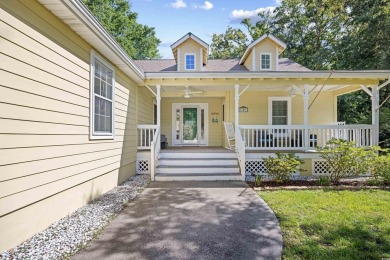 Nestled on a quiet cul-de-sac in The Bluffs at Pawleys Island on Pawleys Plantation Golf and Country Club in South Carolina - for sale on GolfHomes.com, golf home, golf lot