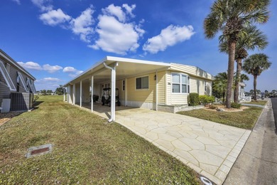 Discover comfort, style, and scenic golf course living in this on Maple Leaf Golf and Country Club in Florida - for sale on GolfHomes.com, golf home, golf lot