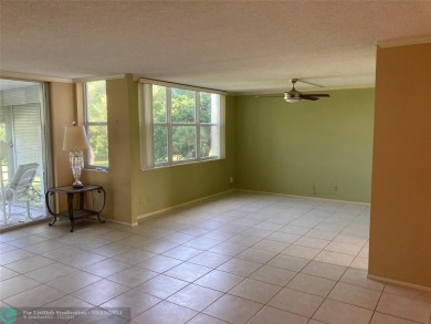 Opportunity knocks with this spacious F unit in Palm Aire on Oaks Country Club in Florida - for sale on GolfHomes.com, golf home, golf lot