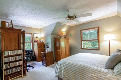 This contemporary mountain home situated on a private wooded lot on Mt. Mitchell Golf Course in North Carolina - for sale on GolfHomes.com, golf home, golf lot