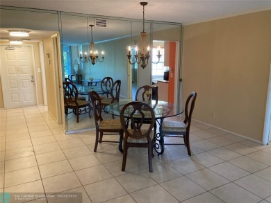 Opportunity knocks with this spacious F unit in Palm Aire on Oaks Country Club in Florida - for sale on GolfHomes.com, golf home, golf lot