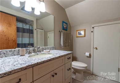 This contemporary mountain home situated on a private wooded lot on Mt. Mitchell Golf Course in North Carolina - for sale on GolfHomes.com, golf home, golf lot