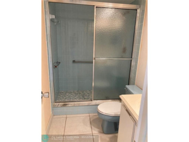 Opportunity knocks with this spacious F unit in Palm Aire on Oaks Country Club in Florida - for sale on GolfHomes.com, golf home, golf lot
