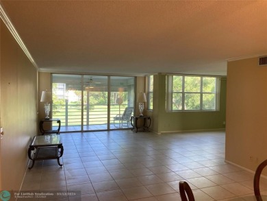 Opportunity knocks with this spacious F unit in Palm Aire on Oaks Country Club in Florida - for sale on GolfHomes.com, golf home, golf lot