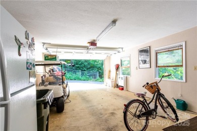 This contemporary mountain home situated on a private wooded lot on Mt. Mitchell Golf Course in North Carolina - for sale on GolfHomes.com, golf home, golf lot
