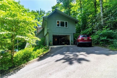 This contemporary mountain home situated on a private wooded lot on Mt. Mitchell Golf Course in North Carolina - for sale on GolfHomes.com, golf home, golf lot
