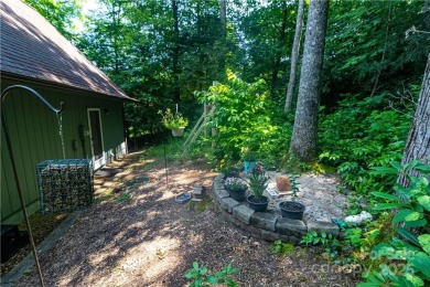 This contemporary mountain home situated on a private wooded lot on Mt. Mitchell Golf Course in North Carolina - for sale on GolfHomes.com, golf home, golf lot