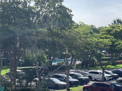 Opportunity knocks with this spacious F unit in Palm Aire on Oaks Country Club in Florida - for sale on GolfHomes.com, golf home, golf lot