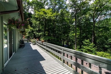 This contemporary mountain home situated on a private wooded lot on Mt. Mitchell Golf Course in North Carolina - for sale on GolfHomes.com, golf home, golf lot