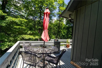 This contemporary mountain home situated on a private wooded lot on Mt. Mitchell Golf Course in North Carolina - for sale on GolfHomes.com, golf home, golf lot