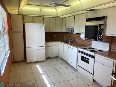 Opportunity knocks with this spacious F unit in Palm Aire on Oaks Country Club in Florida - for sale on GolfHomes.com, golf home, golf lot