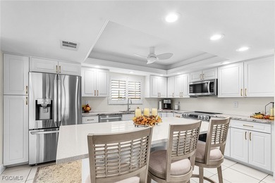 Discover this charming 1st-floor condo in Carriedale Gardens on Fiddlesticks Country Club in Florida - for sale on GolfHomes.com, golf home, golf lot