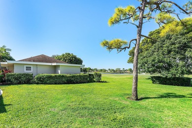 This beautifully redesigned 2-bedroom, 2-bath residence is on Eastpointe Country Club in Florida - for sale on GolfHomes.com, golf home, golf lot