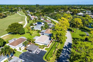 This beautifully redesigned 2-bedroom, 2-bath residence is on Eastpointe Country Club in Florida - for sale on GolfHomes.com, golf home, golf lot