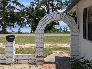 Enjoy gorgeous water views from the private front courtyard of on St. James Bay in Florida - for sale on GolfHomes.com, golf home, golf lot