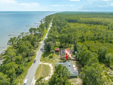 Enjoy gorgeous water views from the private front courtyard of on St. James Bay in Florida - for sale on GolfHomes.com, golf home, golf lot