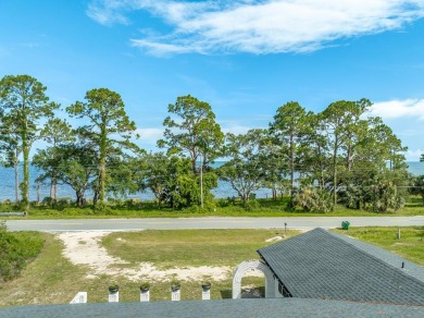 Enjoy gorgeous water views from the private front courtyard of on St. James Bay in Florida - for sale on GolfHomes.com, golf home, golf lot