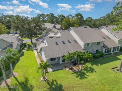 This end-unit villa condominium offers scenic golf course views on Spruce Creek Golf Club in Florida - for sale on GolfHomes.com, golf home, golf lot
