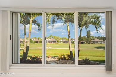 This end-unit villa condominium offers scenic golf course views on Spruce Creek Golf Club in Florida - for sale on GolfHomes.com, golf home, golf lot