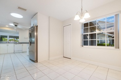 This end-unit villa condominium offers scenic golf course views on Spruce Creek Golf Club in Florida - for sale on GolfHomes.com, golf home, golf lot