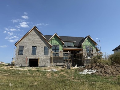 Stunning new construction located in a premier gated golf course on The Bull At Boones Trace in Kentucky - for sale on GolfHomes.com, golf home, golf lot