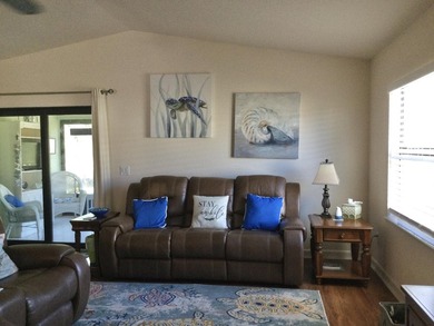 Move right into this concrete block home that backs up to the on Spanish Lakes I in Florida - for sale on GolfHomes.com, golf home, golf lot