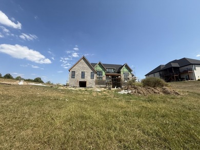 Stunning new construction located in a premier gated golf course on The Bull At Boones Trace in Kentucky - for sale on GolfHomes.com, golf home, golf lot