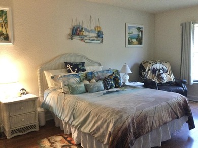 Move right into this concrete block home that backs up to the on Spanish Lakes I in Florida - for sale on GolfHomes.com, golf home, golf lot