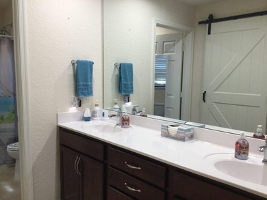 Move right into this concrete block home that backs up to the on Spanish Lakes I in Florida - for sale on GolfHomes.com, golf home, golf lot