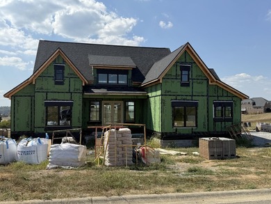 Stunning new construction located in a premier gated golf course on The Bull At Boones Trace in Kentucky - for sale on GolfHomes.com, golf home, golf lot