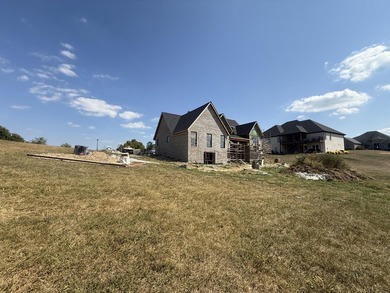 Stunning new construction located in a premier gated golf course on The Bull At Boones Trace in Kentucky - for sale on GolfHomes.com, golf home, golf lot