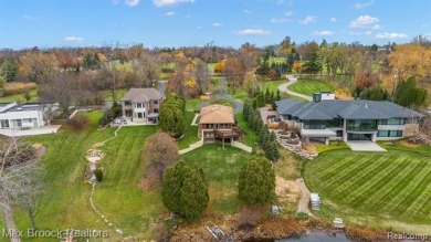 Experience the charm and tranquility of lakefront living in this on Forest Lake Country Club in Michigan - for sale on GolfHomes.com, golf home, golf lot