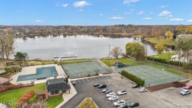 Experience the charm and tranquility of lakefront living in this on Forest Lake Country Club in Michigan - for sale on GolfHomes.com, golf home, golf lot