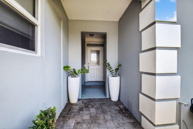 THIS COMPLETELY REMODELED VILLA HAS WIDE OPEN VIEWS OF THE 15TH on Delray Dunes Golf and Country Club in Florida - for sale on GolfHomes.com, golf home, golf lot
