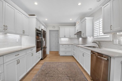 THIS COMPLETELY REMODELED VILLA HAS WIDE OPEN VIEWS OF THE 15TH on Delray Dunes Golf and Country Club in Florida - for sale on GolfHomes.com, golf home, golf lot