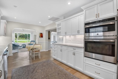 THIS COMPLETELY REMODELED VILLA HAS WIDE OPEN VIEWS OF THE 15TH on Delray Dunes Golf and Country Club in Florida - for sale on GolfHomes.com, golf home, golf lot