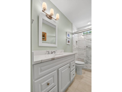 THIS COMPLETELY REMODELED VILLA HAS WIDE OPEN VIEWS OF THE 15TH on Delray Dunes Golf and Country Club in Florida - for sale on GolfHomes.com, golf home, golf lot
