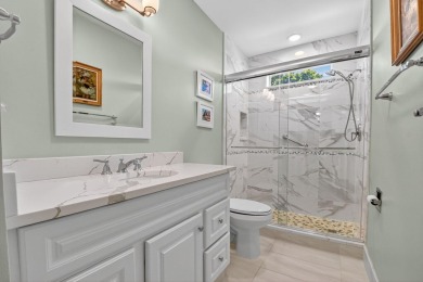 THIS COMPLETELY REMODELED VILLA HAS WIDE OPEN VIEWS OF THE 15TH on Delray Dunes Golf and Country Club in Florida - for sale on GolfHomes.com, golf home, golf lot