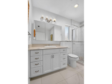 THIS COMPLETELY REMODELED VILLA HAS WIDE OPEN VIEWS OF THE 15TH on Delray Dunes Golf and Country Club in Florida - for sale on GolfHomes.com, golf home, golf lot